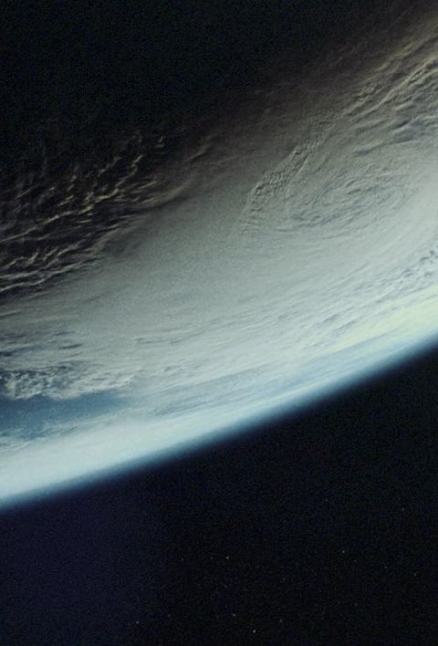 View of Earth from space, partially in shadow